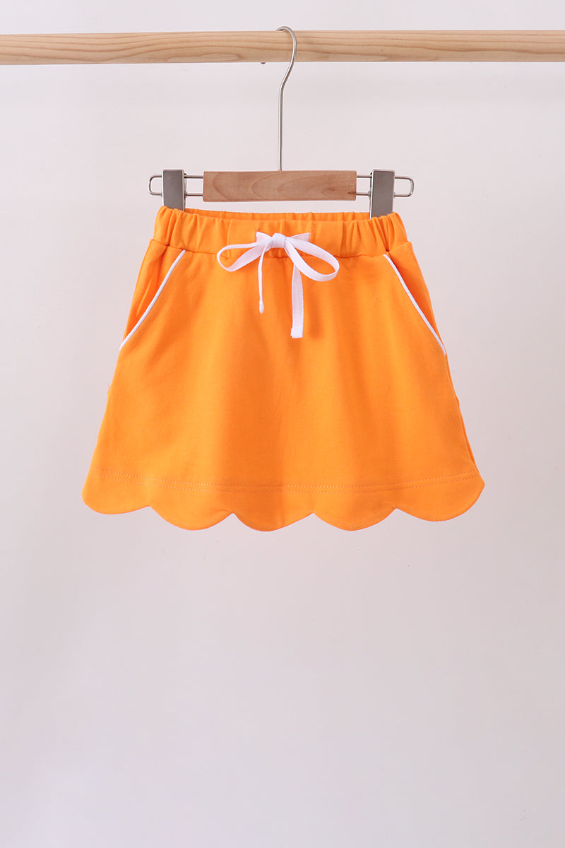 Orange scallop hem bow skort